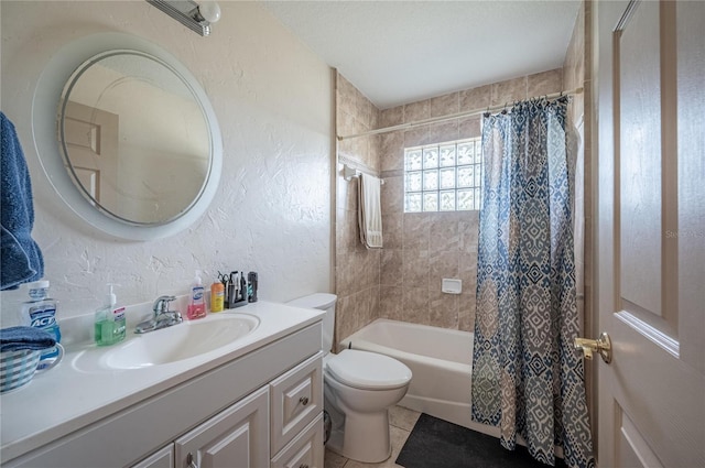 full bathroom featuring tile patterned flooring, vanity, toilet, shower / bath combo, and a textured ceiling