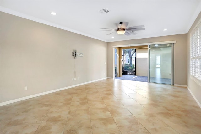 spare room featuring crown molding, light tile patterned floors, and ceiling fan