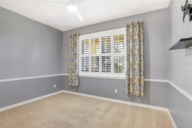 carpeted empty room with ceiling fan