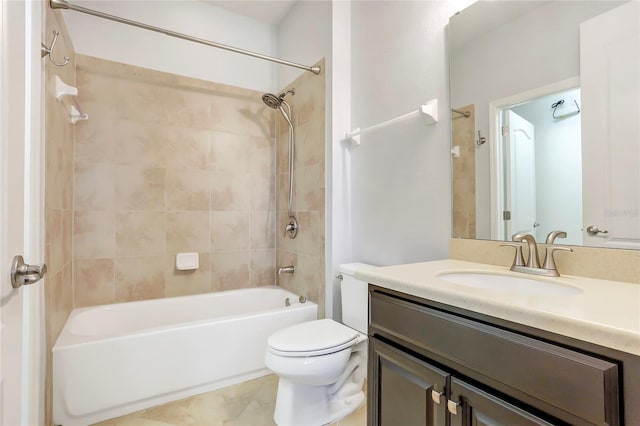 full bathroom with vanity, toilet, and tiled shower / bath combo