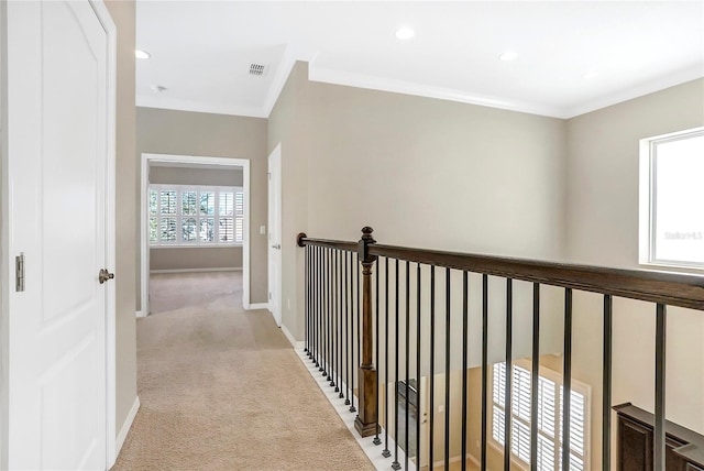 corridor featuring light carpet and ornamental molding