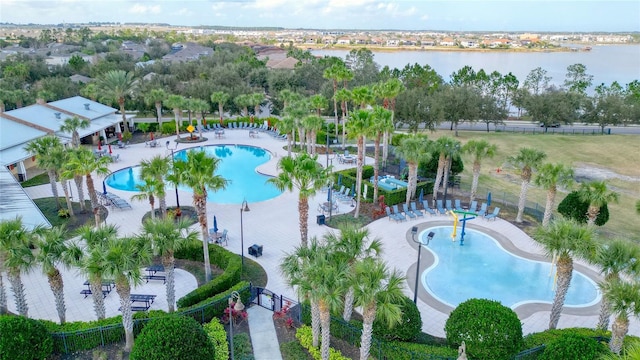 birds eye view of property with a water view