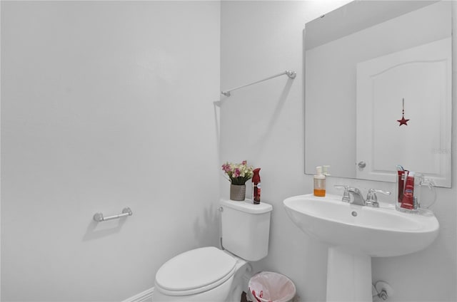 bathroom with sink and toilet