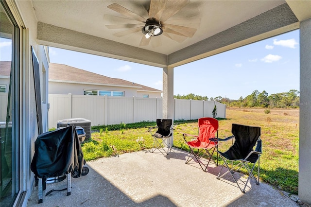 view of patio / terrace featuring cooling unit, ceiling fan, and a grill