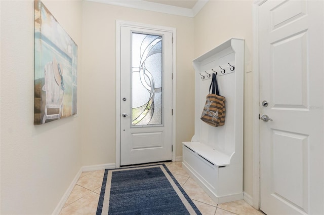 mudroom with ornamental molding, a healthy amount of sunlight, and light tile patterned floors