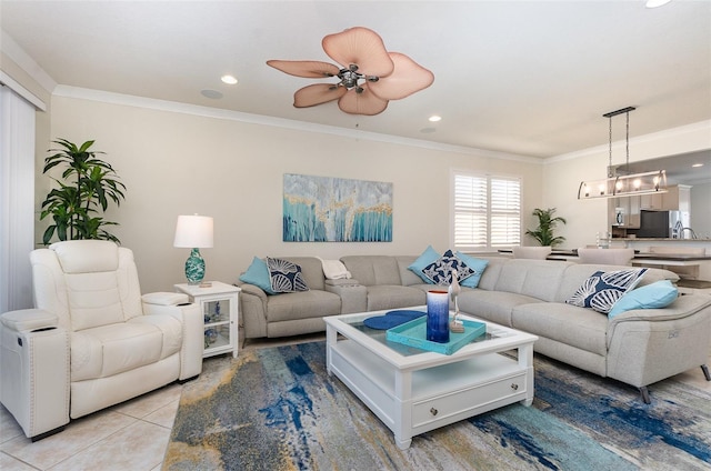 tiled living room featuring ornamental molding and ceiling fan