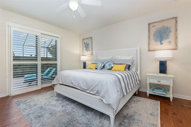 bedroom with dark hardwood / wood-style floors and ceiling fan