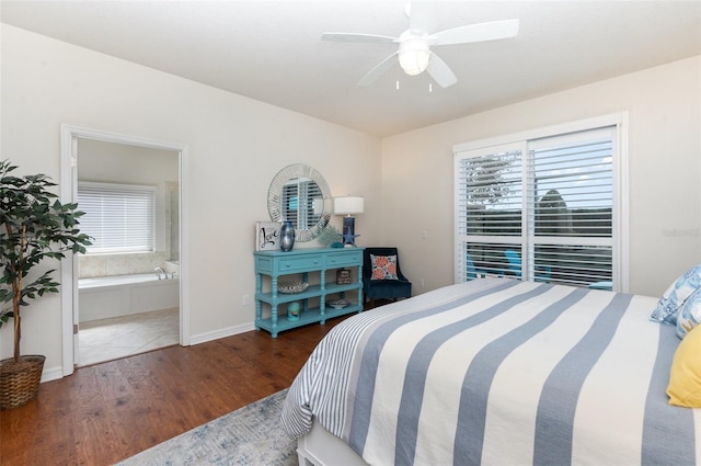 bedroom with ensuite bath, dark wood-type flooring, and ceiling fan