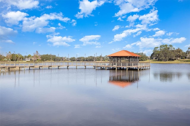 dock area with a gazebo and a water view