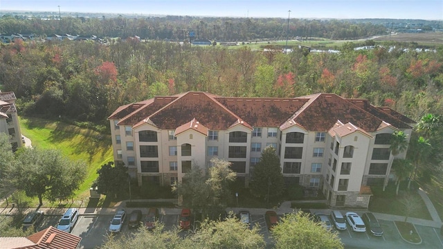 birds eye view of property with a forest view