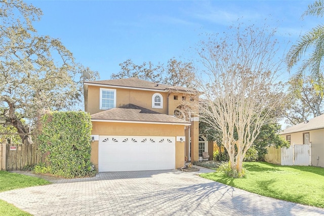 view of front of home featuring a garage and a front yard