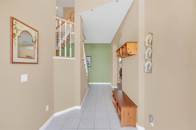 corridor with light tile patterned floors