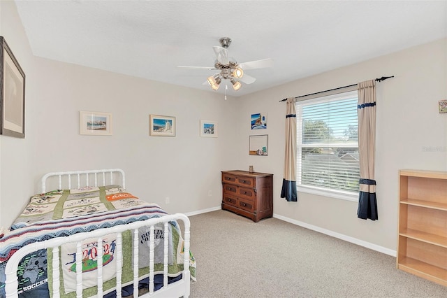 bedroom with light colored carpet and ceiling fan