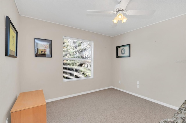 empty room with light colored carpet and ceiling fan