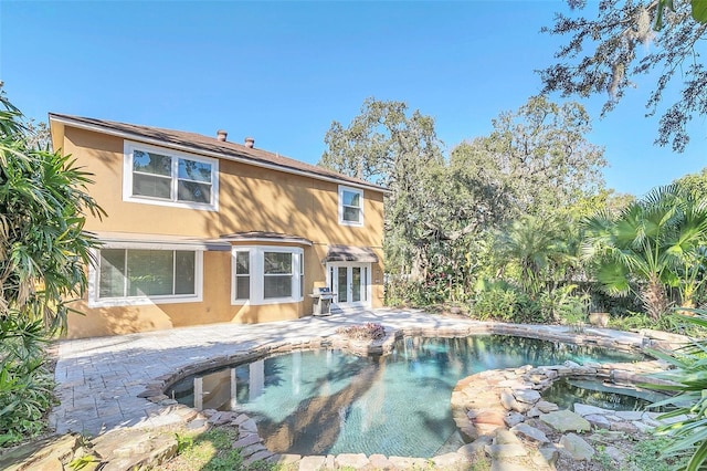 back of property featuring a patio and french doors