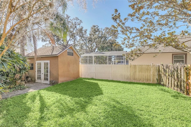 view of yard featuring french doors