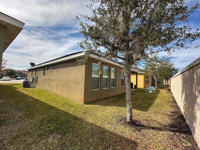 view of home's exterior with a lawn