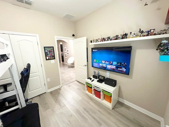 living room with light hardwood / wood-style floors