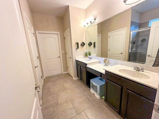 bathroom featuring walk in shower and vanity