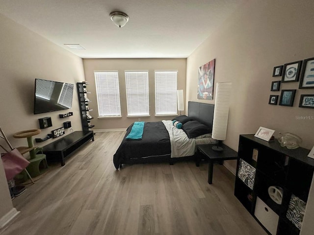 bedroom with hardwood / wood-style flooring