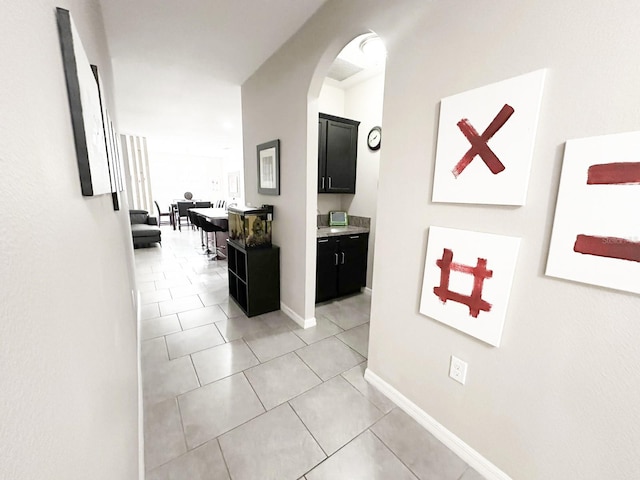 corridor with light tile patterned floors