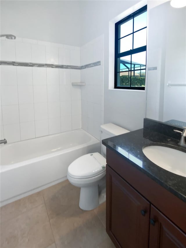 full bathroom featuring tile patterned flooring, vanity, shower / bathtub combination, and toilet