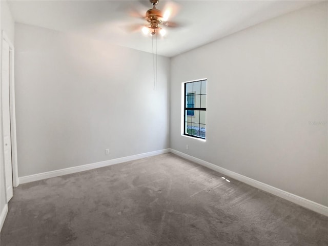 carpeted empty room with ceiling fan