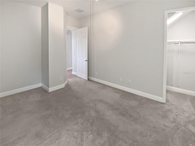 unfurnished bedroom with carpet floors and a closet