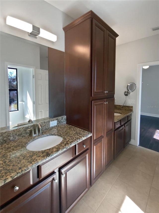 bathroom with vanity and tile patterned floors