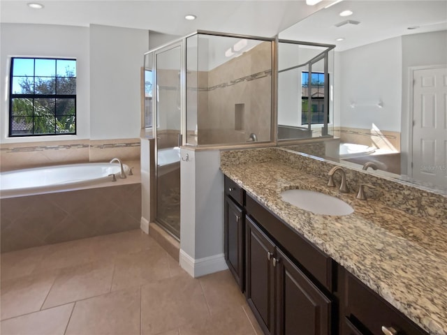 bathroom with vanity, plus walk in shower, and tile patterned flooring