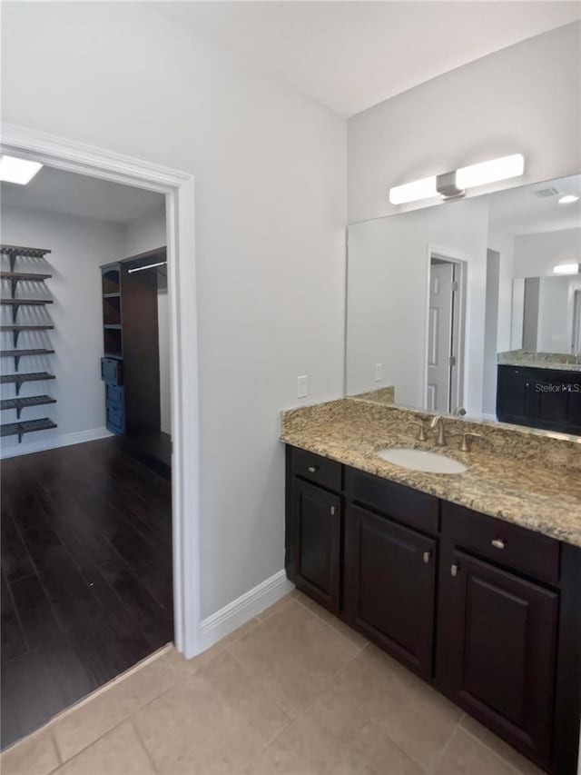 bathroom featuring vanity and tile patterned flooring