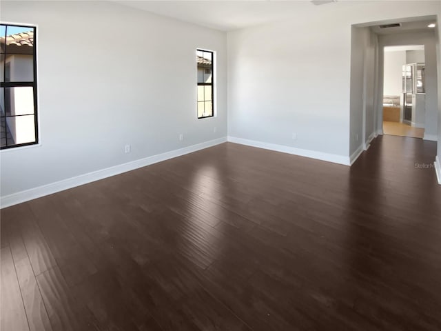 empty room featuring dark hardwood / wood-style floors