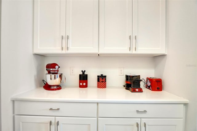 bar featuring white cabinetry