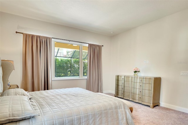 carpeted bedroom with baseboards