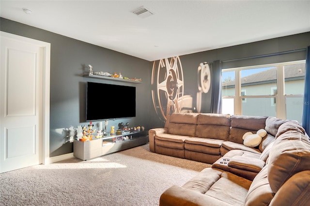 carpeted living room featuring baseboards and visible vents