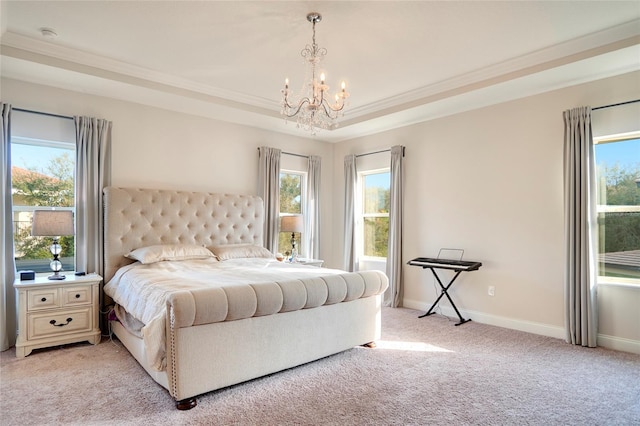 bedroom featuring light carpet, a notable chandelier, ornamental molding, and a raised ceiling