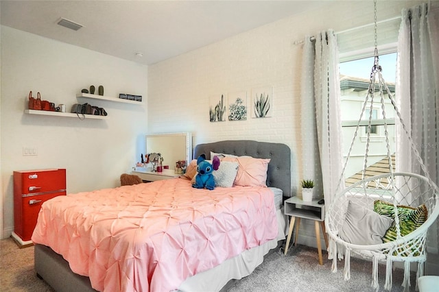 bedroom with visible vents and carpet flooring