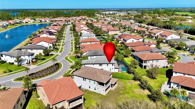 birds eye view of property featuring a residential view and a water view