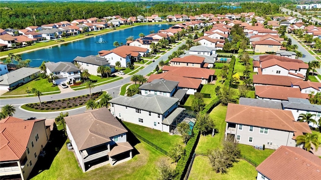 aerial view featuring a water view and a residential view