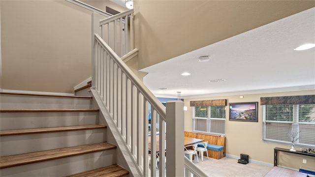 staircase with crown molding