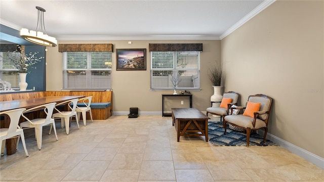 sitting room featuring crown molding and light tile patterned floors