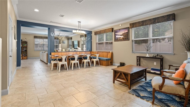 interior space featuring an inviting chandelier and crown molding