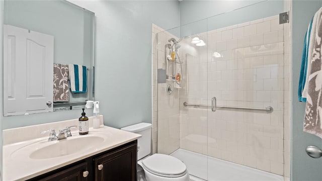 bathroom featuring walk in shower, vanity, and toilet