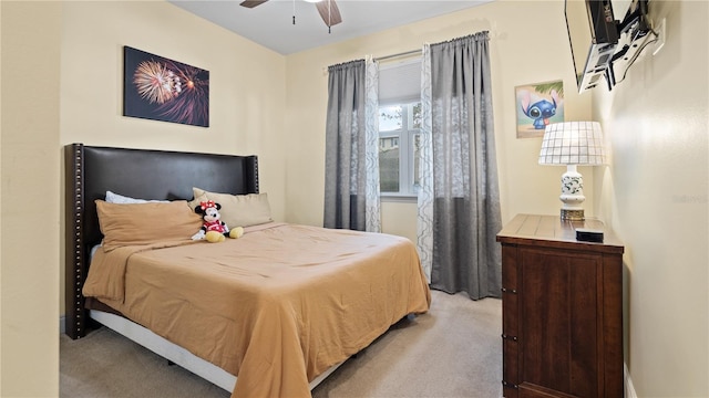 bedroom with ceiling fan and light colored carpet