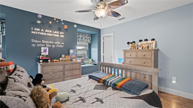 bedroom featuring ceiling fan and light hardwood / wood-style floors