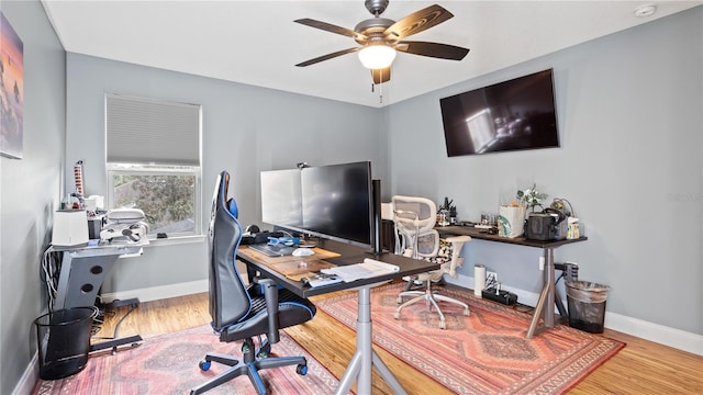 office with hardwood / wood-style floors and ceiling fan