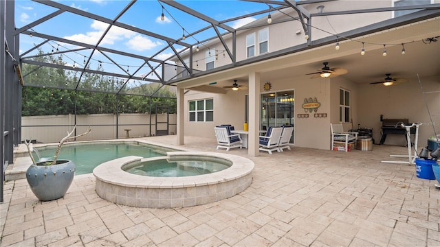 view of swimming pool featuring a patio, ceiling fan, and an in ground hot tub