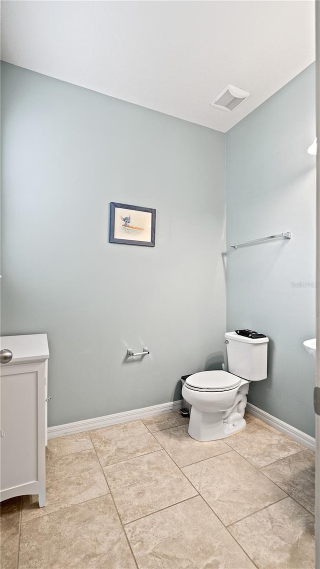 bathroom featuring tile patterned floors and toilet