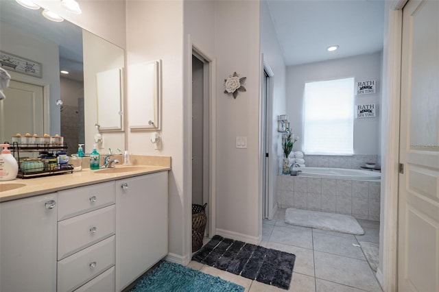 bathroom featuring tile patterned flooring, vanity, and plus walk in shower