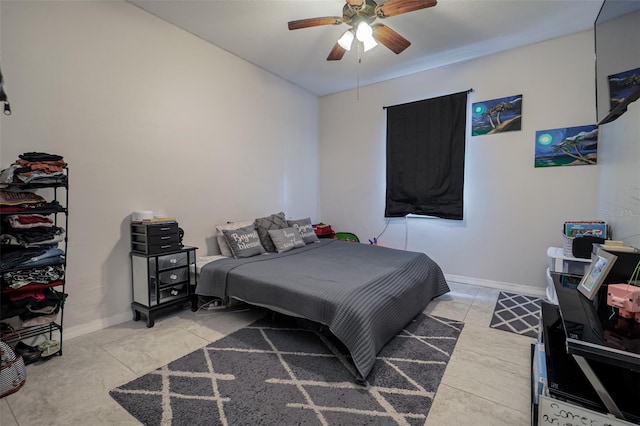 bedroom featuring light tile patterned floors and ceiling fan